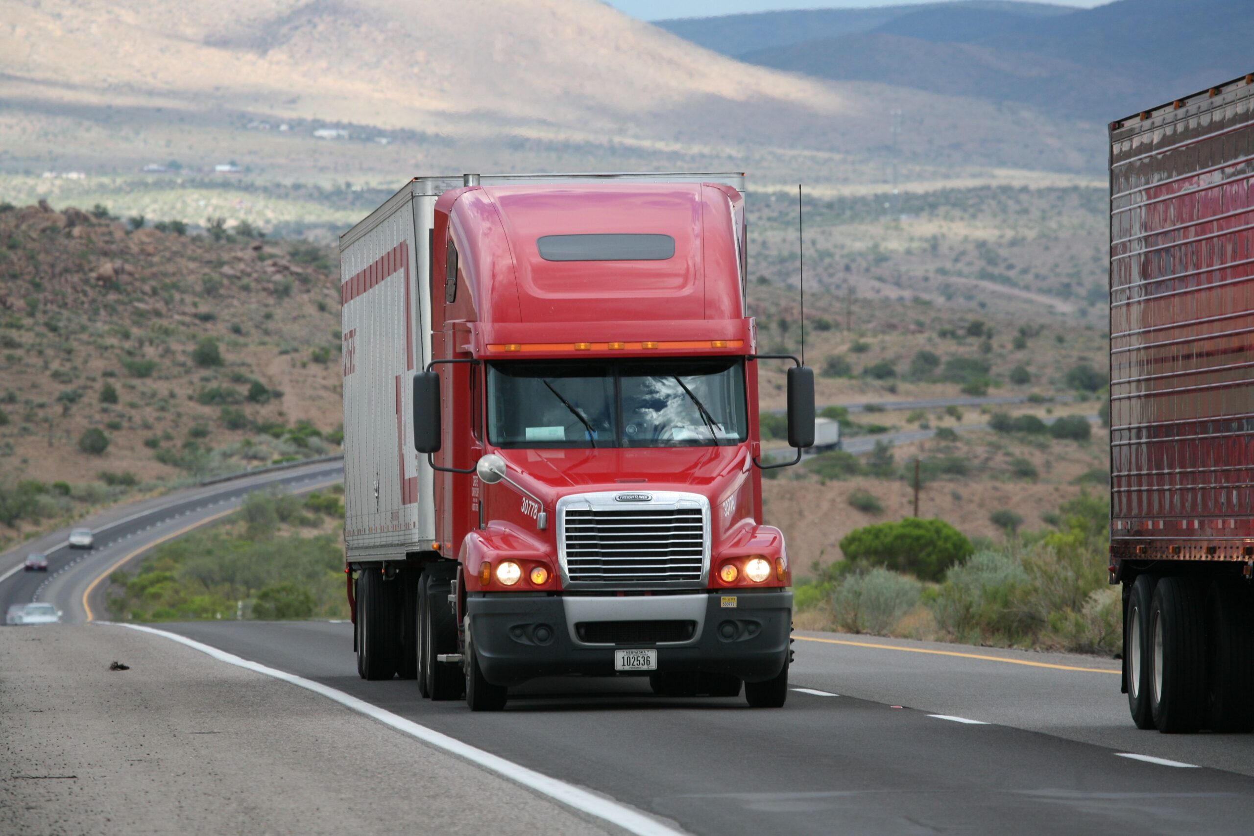 Freight truck driving on desert highway